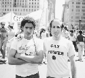 Two homosexual men at gay pride rally in...